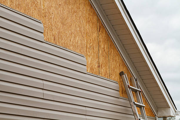Professional Storm Damage Siding Repair technician working in Spencer, WV